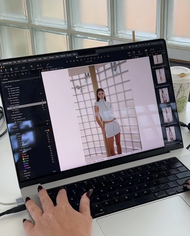 Laptop screen displaying photo editing software with an image of the same outfit.
