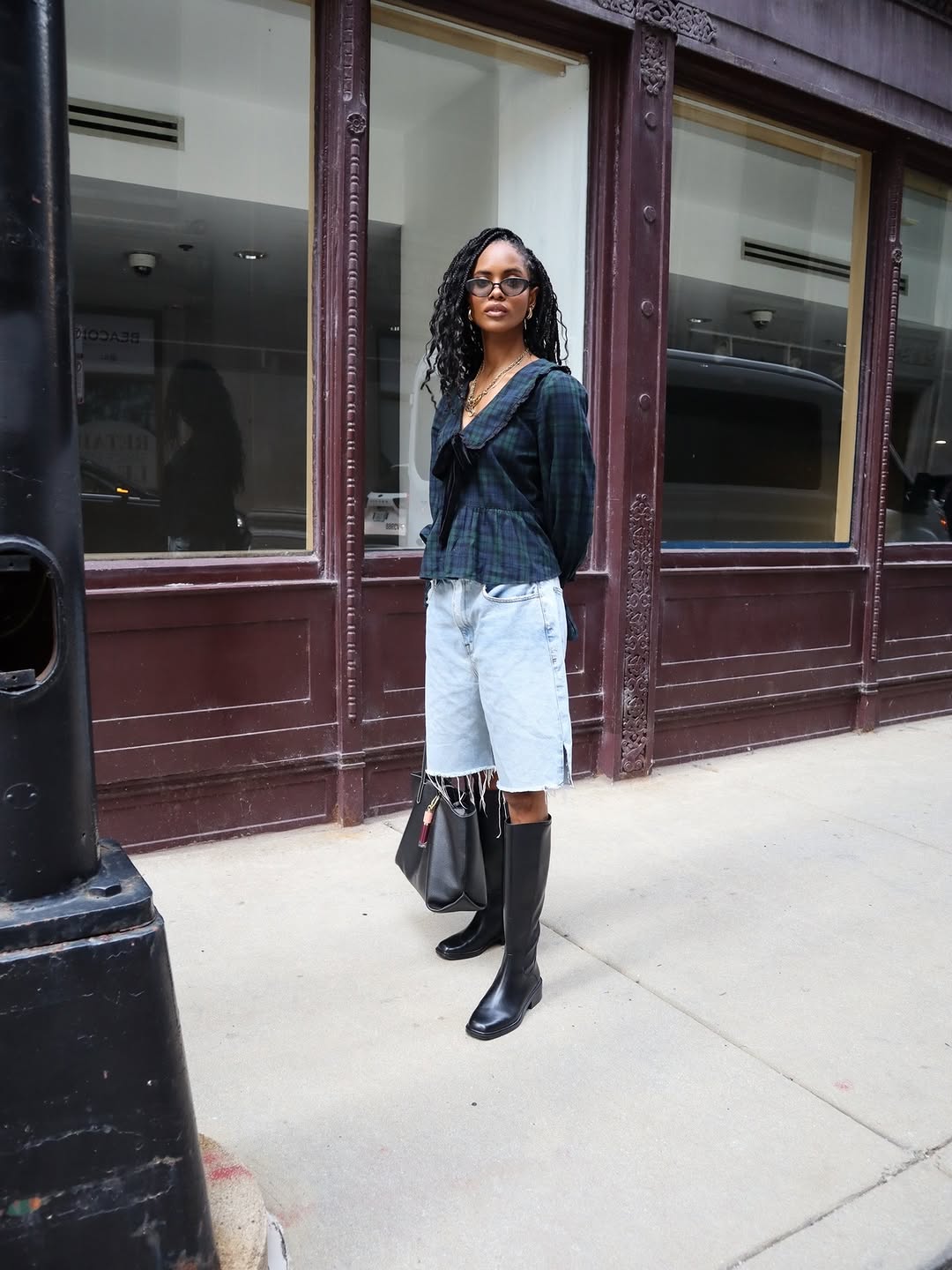 Full body shot standing still, displaying the complete look including sunglasses and jewelry.
