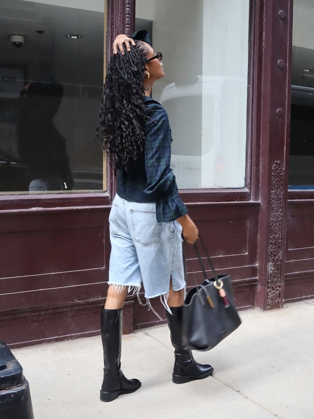 Another side angle capturing the movement of the outfit, specifically the hem of the shorts.